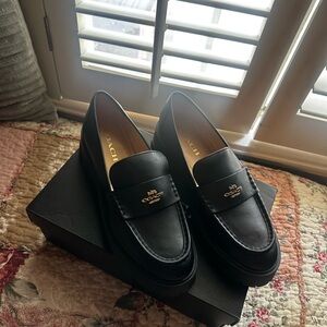 Coach Classic Black Leather Slip-Ons